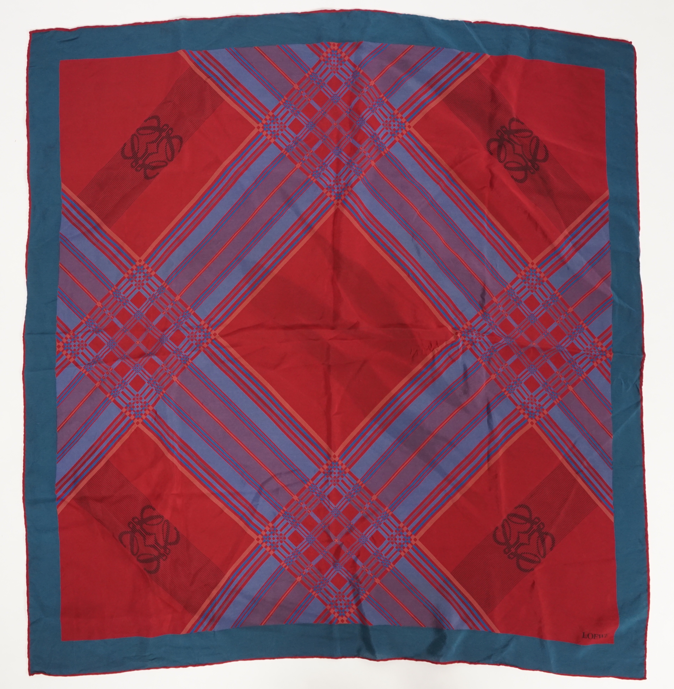 A selection of Yves Saint Laurent, two Christian Dior, Richel and Loewe silk scarves, YSL, 83cm x 85cm Christian Dior: 84cm x 80cm Richel: 87cm x 87cm Loewe: 86cm x 82cm Christian Dior large scarf 120cm x 130cm approx.